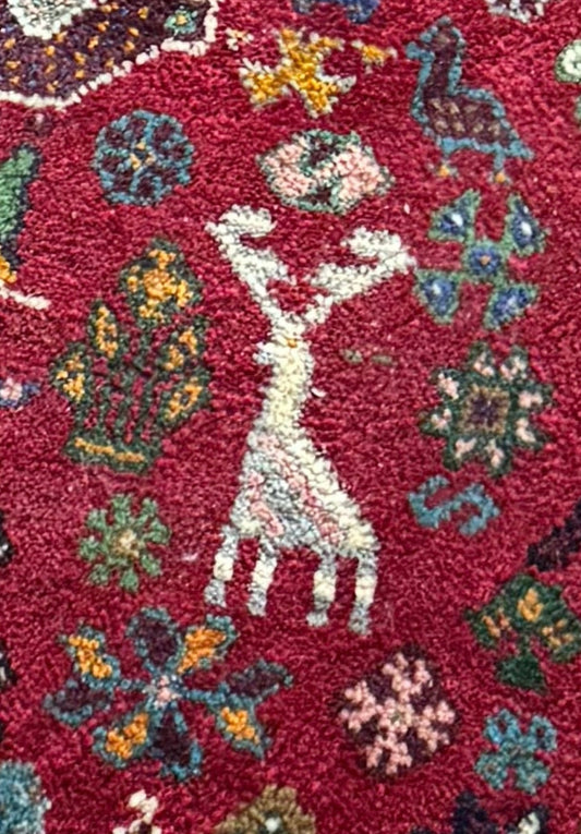 Colourful tribal Persian rug muted colours