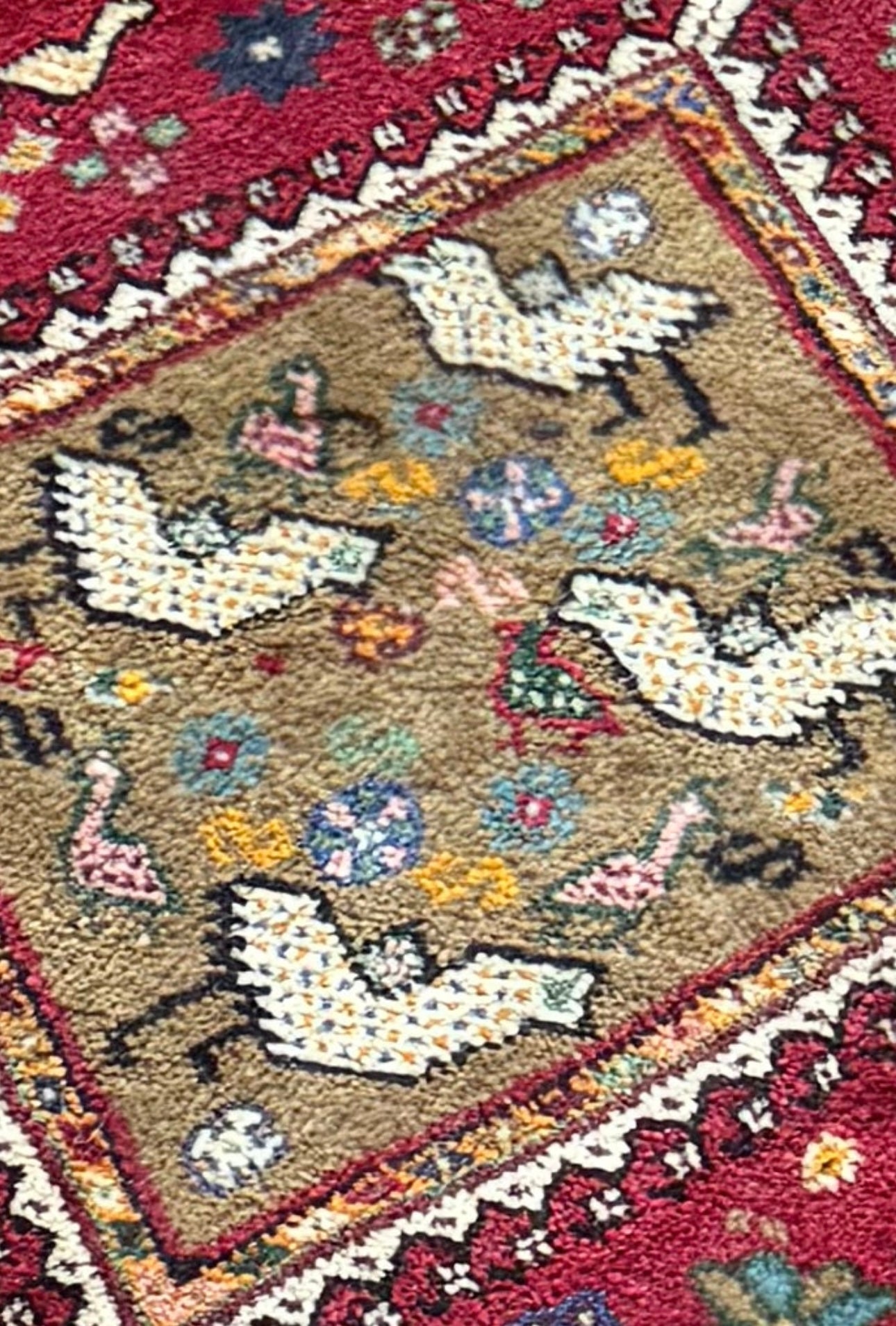 Colourful tribal Persian rug muted colours