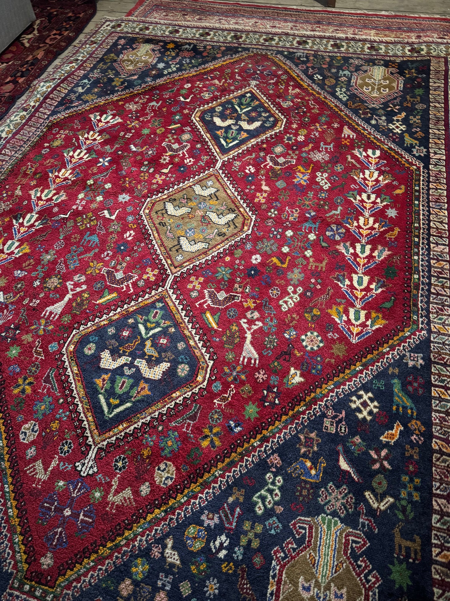 Colourful tribal Persian rug muted colours