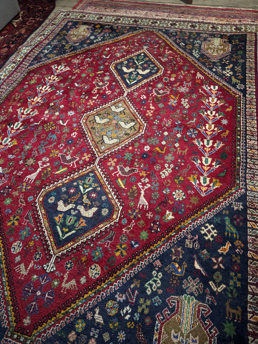 Colourful tribal Persian rug muted colours