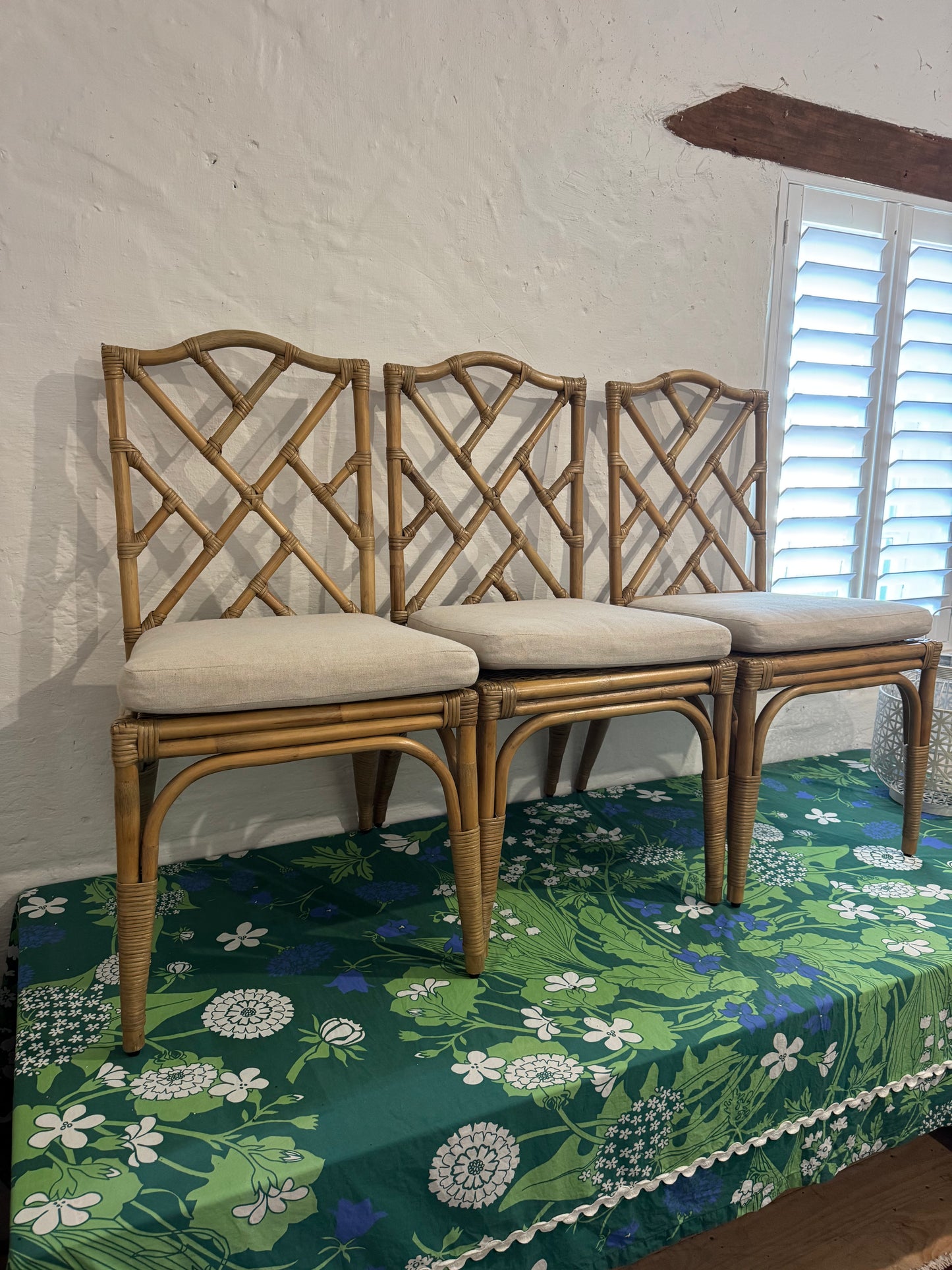 Four bamboo dining chairs with seats