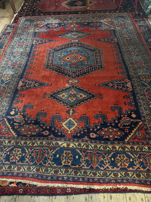 Persian rug navy and rust colours
